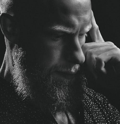 Grayscale Photo of a Bearded Man