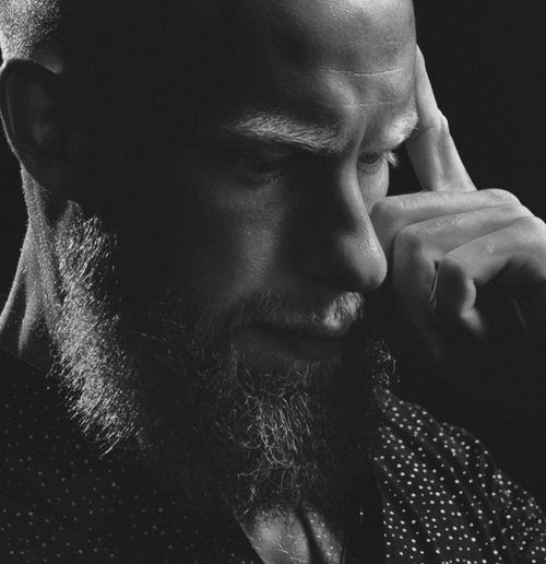 Free Monochrome portrait of a bearded man deep in thought, focusing on facial expression. Stock Photo