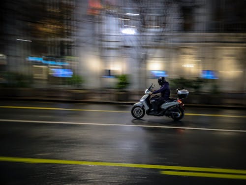 Person Riding a Motorcycle on the Road