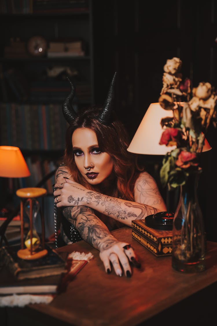 Woman With Devil Horns And Tattoos