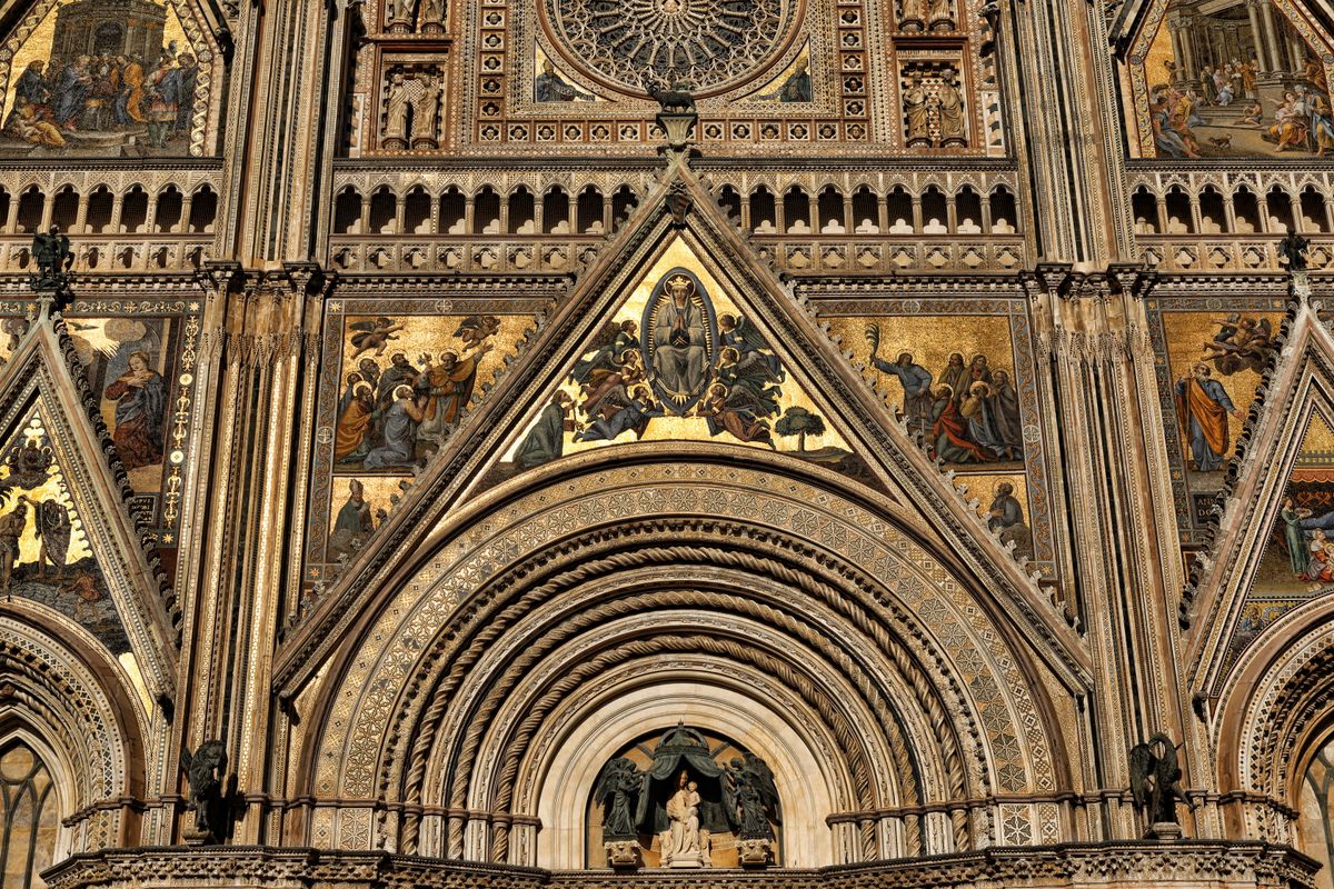 Orvieto's Duomo facade — 300 years of Gothic construction atop a volcanic tufa butte.