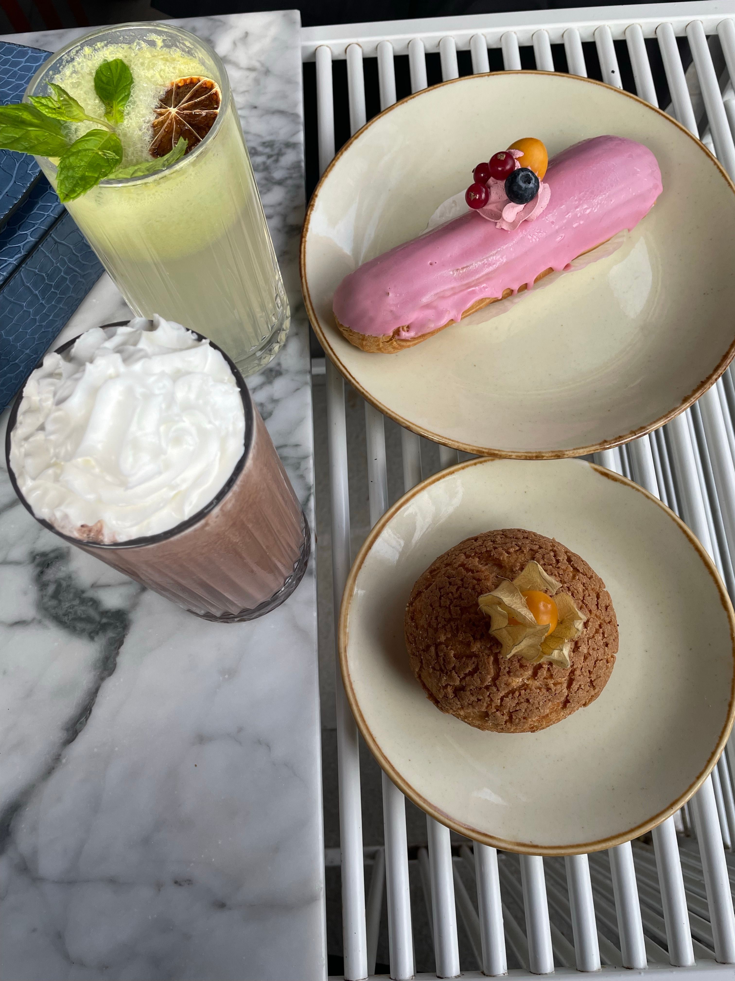 An enticing high-angle view of gourmet desserts and refreshing drinks at a Turkish cafe.