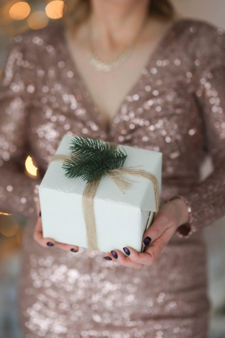 Photo Of A Woman Holding A Gift Box