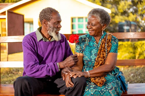 A man Giving a Flower to His Wife