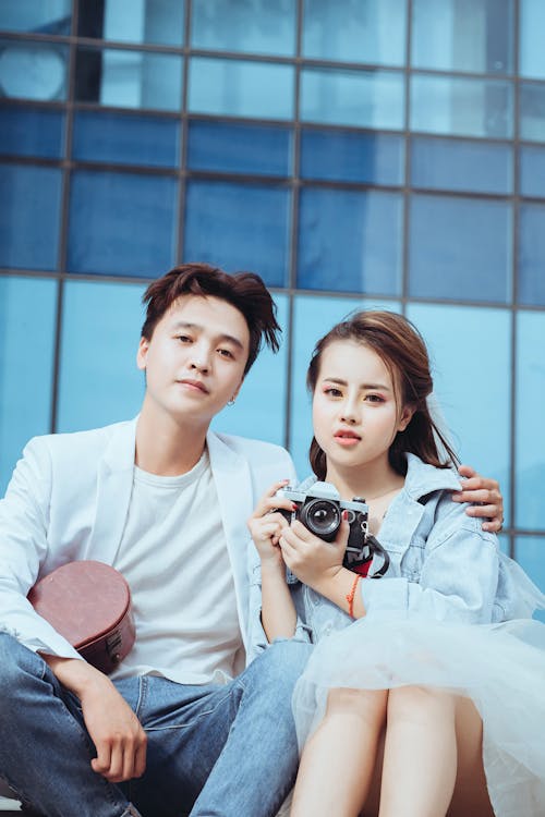 Free Man Beside Woman Carrying Dslr Camera Stock Photo