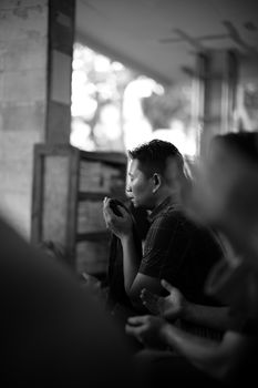 Black and white portrait capturing emotion in a street scene in Semampir, Indonesia. - Fotografer Sidoarjo