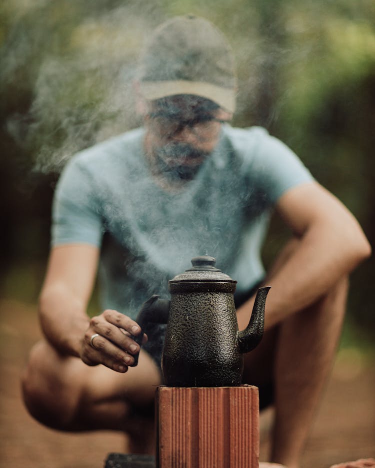 Man Touching Kettle