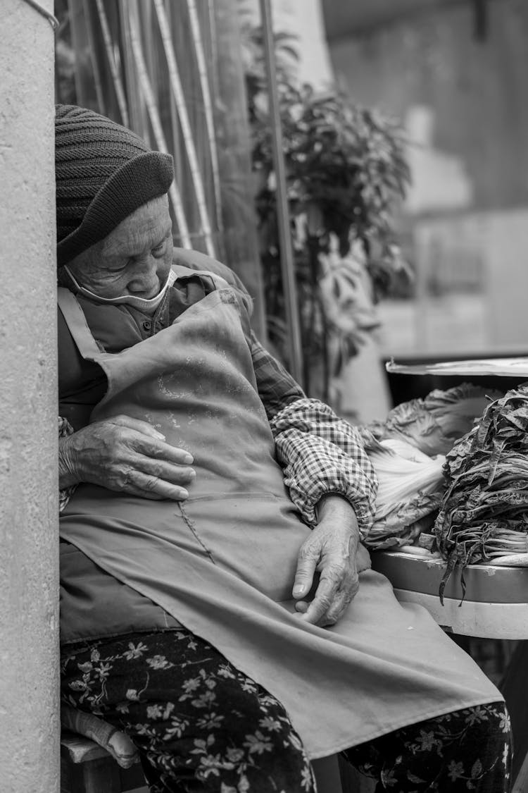 Grayscale Photo Of An Elderly Woman Sleeping