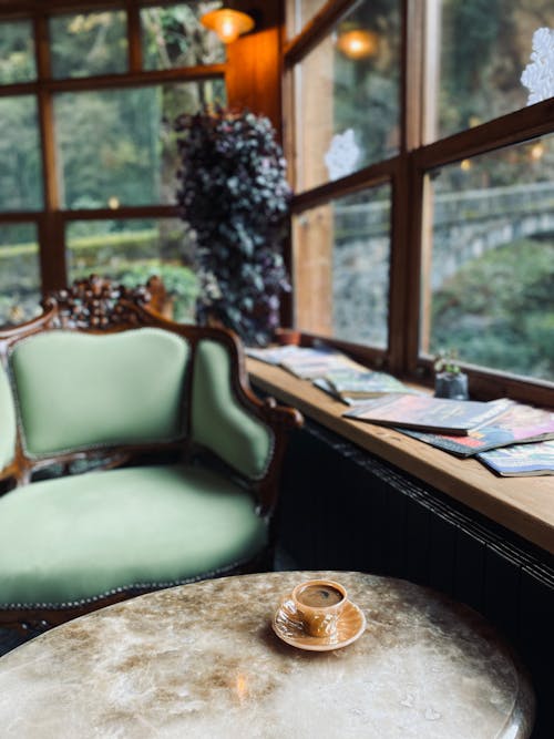 Sofa Chair and a Table Beside the Window