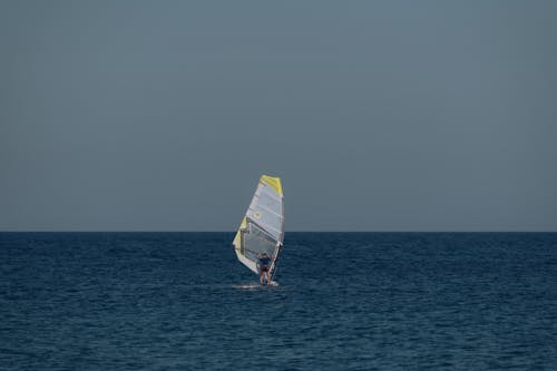 Man Windsurfing on Sea