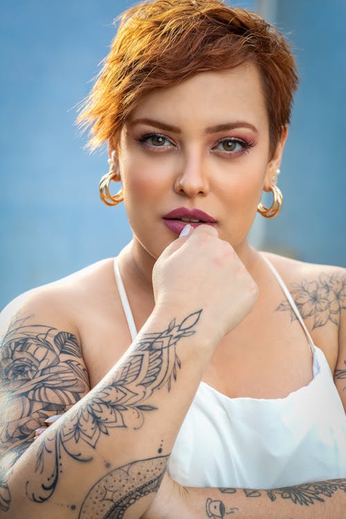 Woman with Tattoos on her Arms 