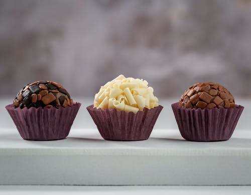 Close-Up Shot of Delicious Cupcakes on White Surface