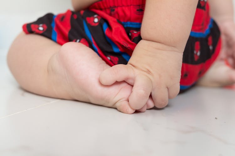 Close-Up Shot Of Baby's Hand And Foot