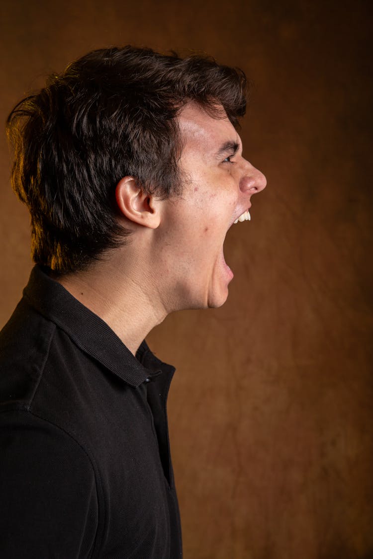 Side View Of A Man Shouting