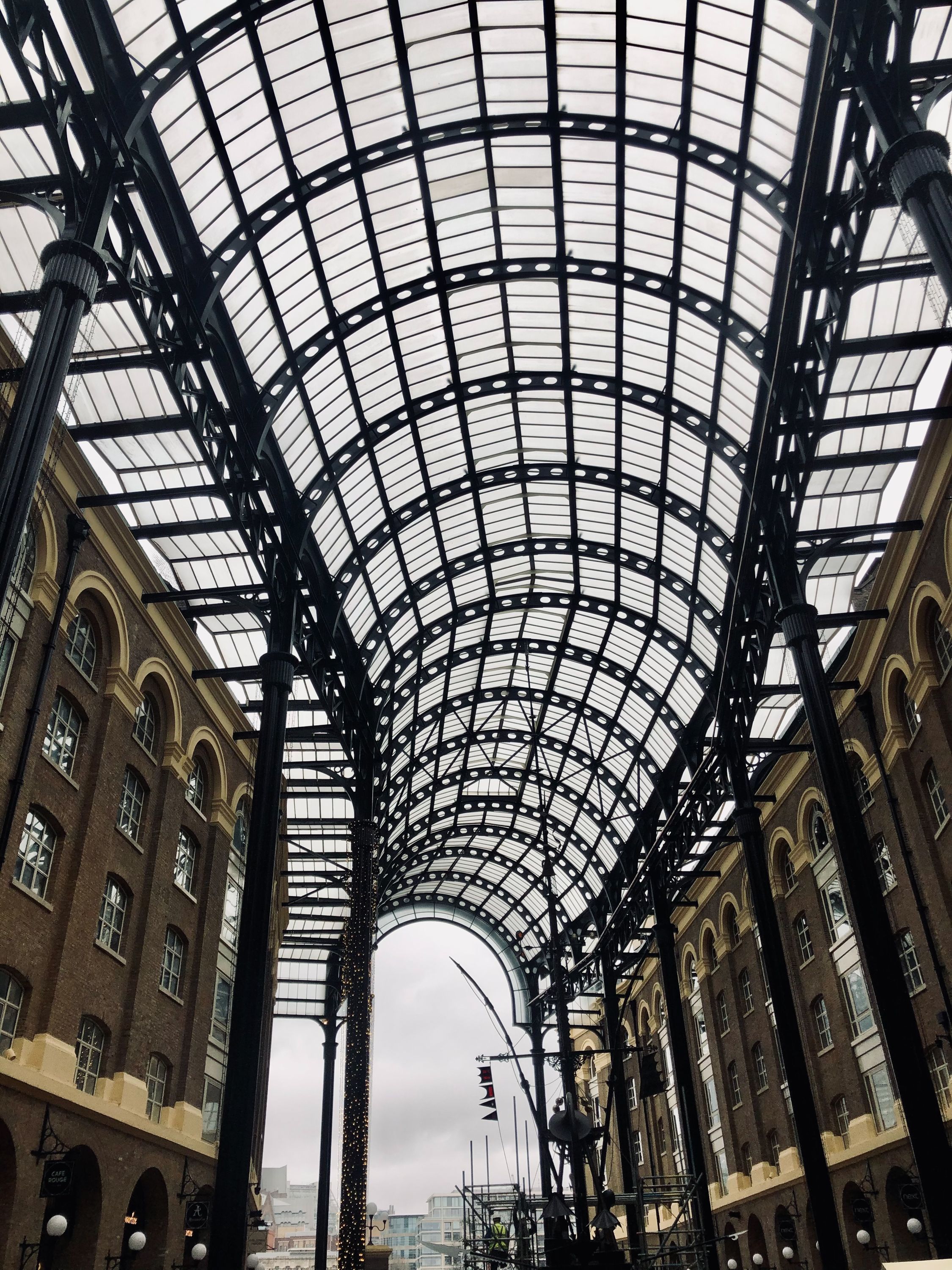 Beautiful glass archway in London showcasing modern architectural design.
