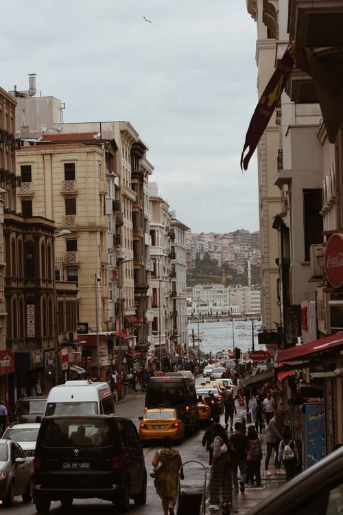 Free Vibrant Istanbul street scene with busy traffic and pedestrians, overlooking the cityscape. Stock Photo