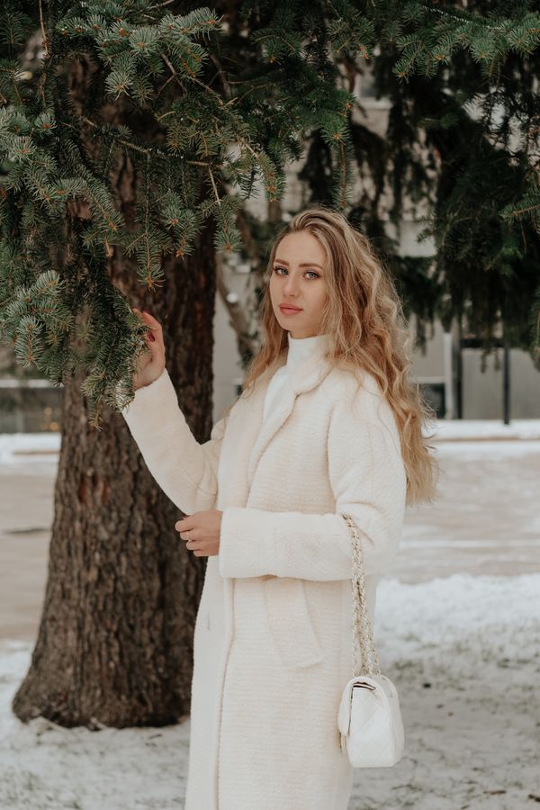White wool coat with casual denim outfit