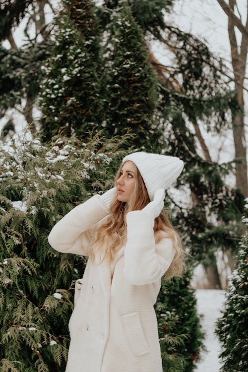 Woman Wearing a Coat and a Hat 