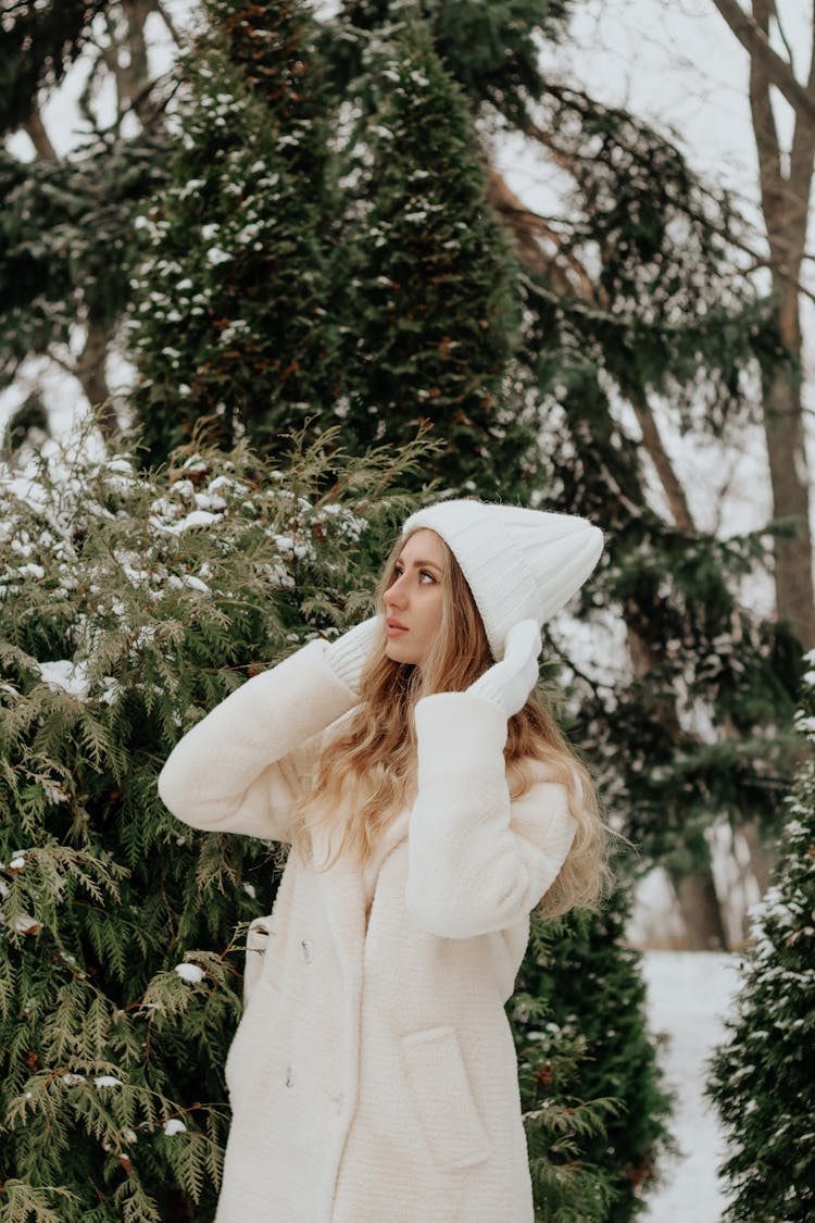 Woman Wearing A Coat And A Hat 