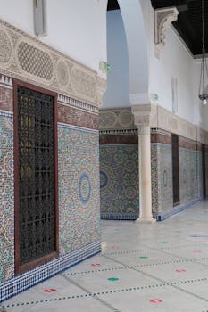 Beautiful Islamic-inspired courtyard in Paris showcasing elaborate tile work and arches.