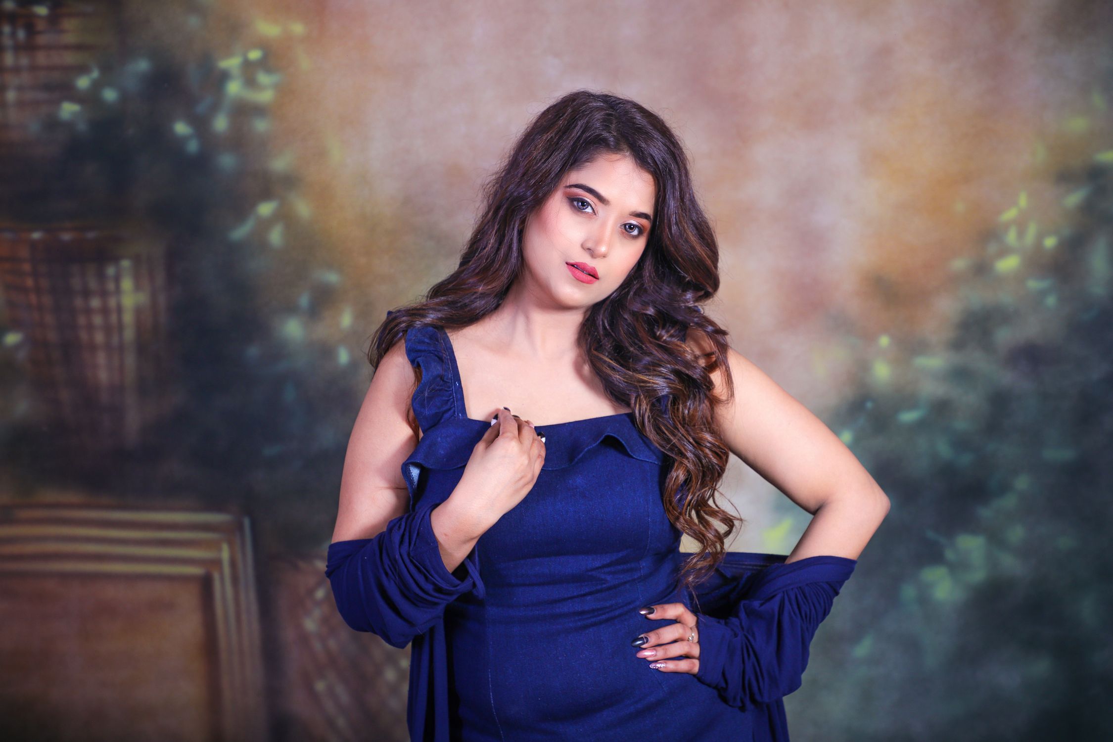 A Woman in a Blue Dress Posing · Free Stock Photo