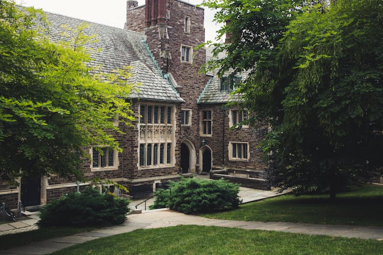 Facade Of The Princeton University Building With Grass And Trees In The Front, Princeton, New Jersey, USA