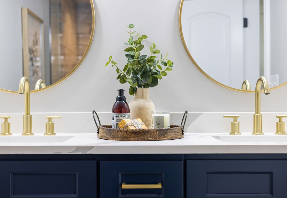 Modern brass bathroom faucet with vanity and mirror