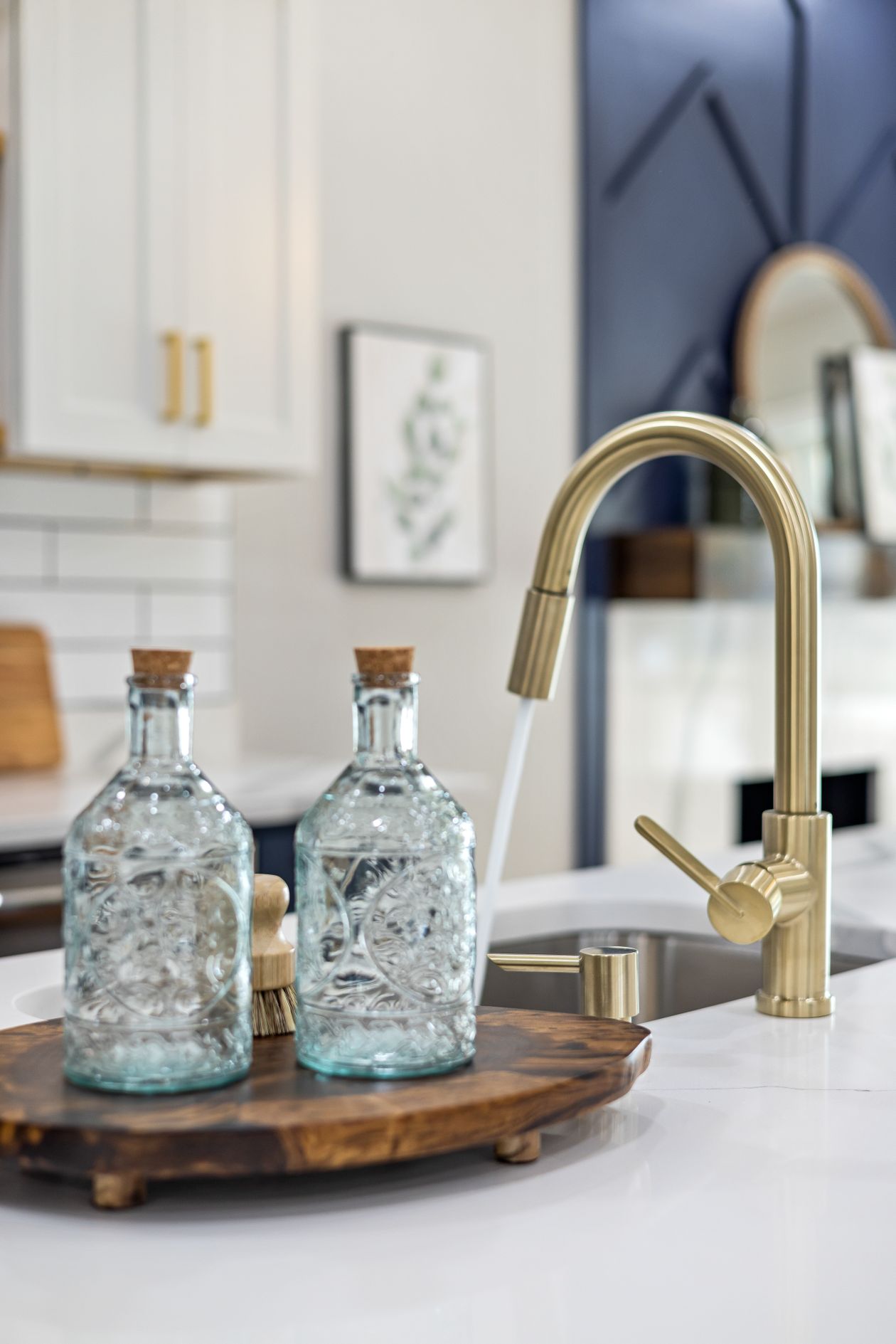 Kitchen with brass fixtures and cabinet hardware