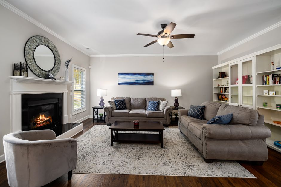 Stylish and cozy living room with a fireplace and comfortable sofas, perfect for relaxation.