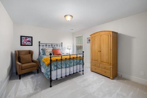 Brown Wooden Cabinet in the Bedroom