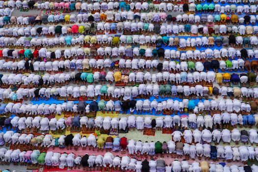 A vibrant overhead shot of a mass prayer gathering in Howrah, India, showcasing cultural unity.
