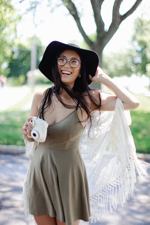 Free Women's Brown Spaghetti-strap Mini Dress Stock Photo