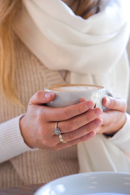 Free Woman Holding a cup of Coffee Stock Photo