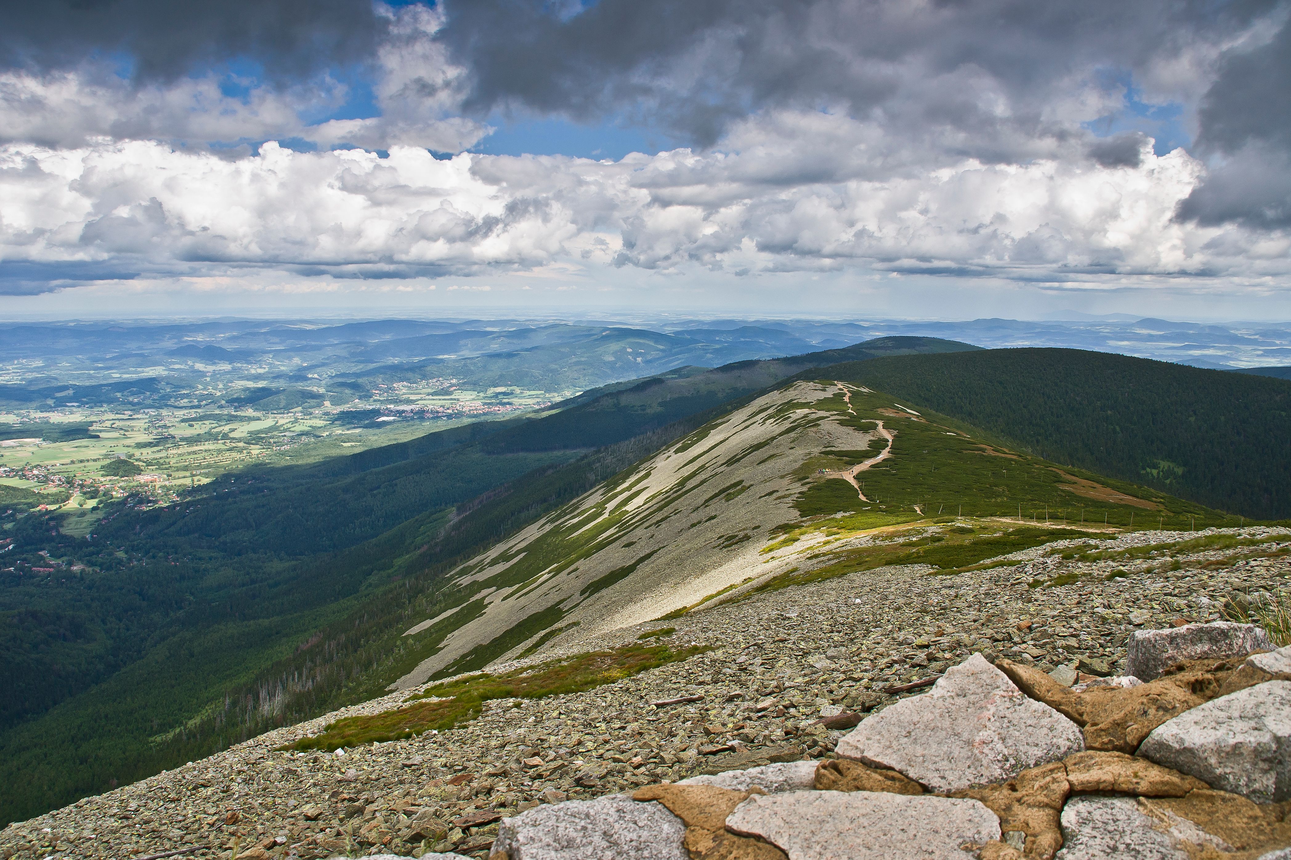 Karkonosze Mountains at golden hour with Sněžka peak, glacial lakes, and dwarf mountain pine forests glowing in warm morning light
