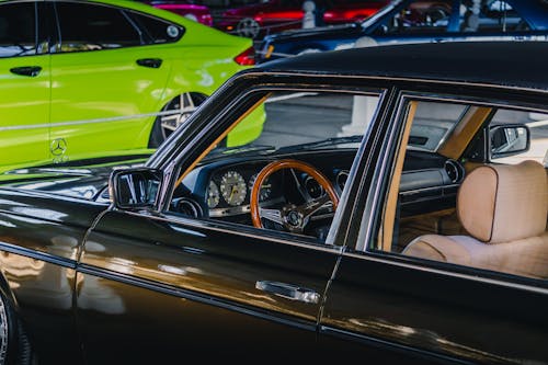 Black Vintage Car with a Wooden Steering Wheel