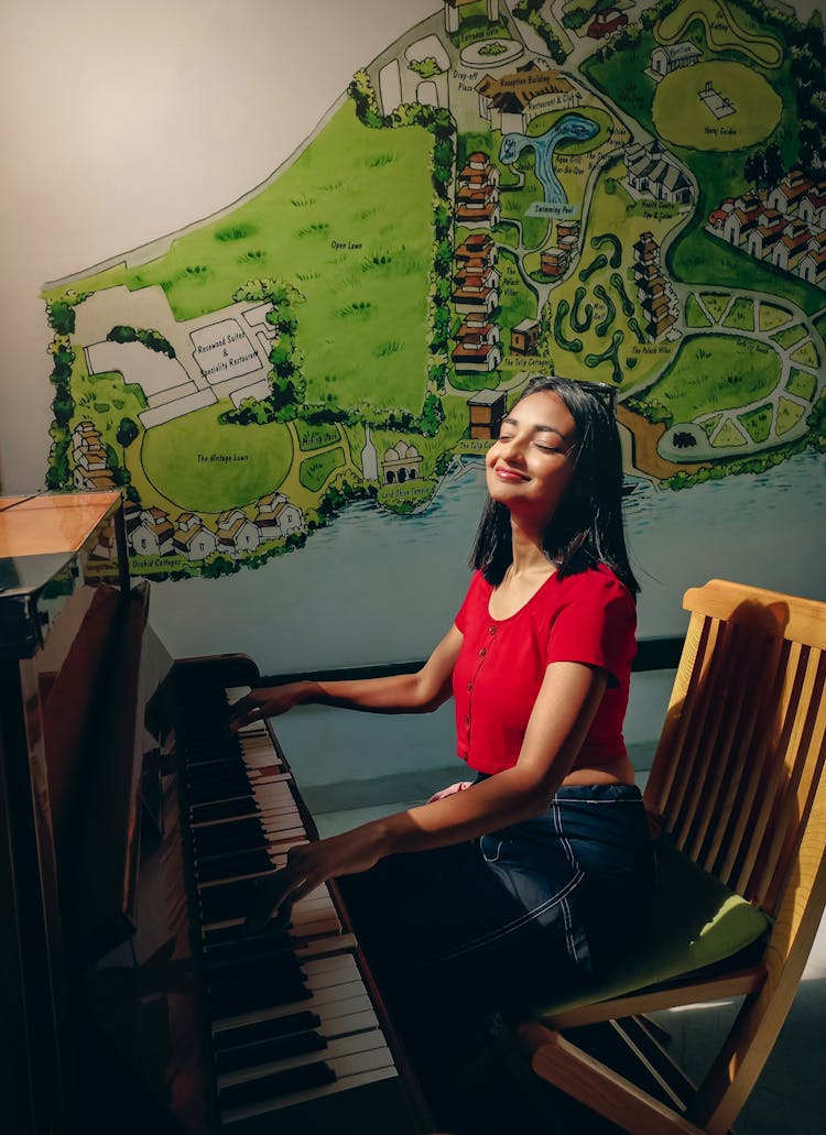 A Girl Playing A Piano