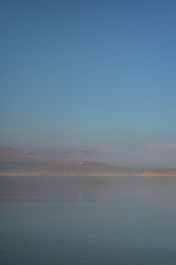 Scenic View Of The Foggy Lake