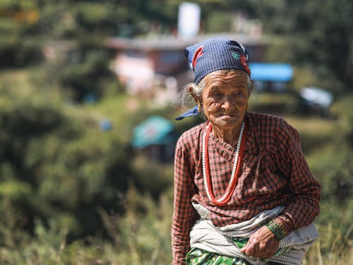 Photo of an Elderly Woman in Traditional Clothes