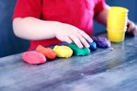 Person Making Clay Figures