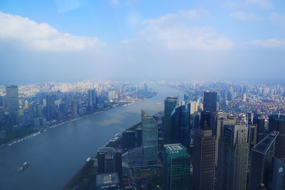 Unbeatable Zhangjiajie Private Helicopter Tour to Explore Real Avatar World Review 2026 - A breathtaking aerial cityscape of Shanghai, China, featuring skyscrapers along the Huangpu River.
