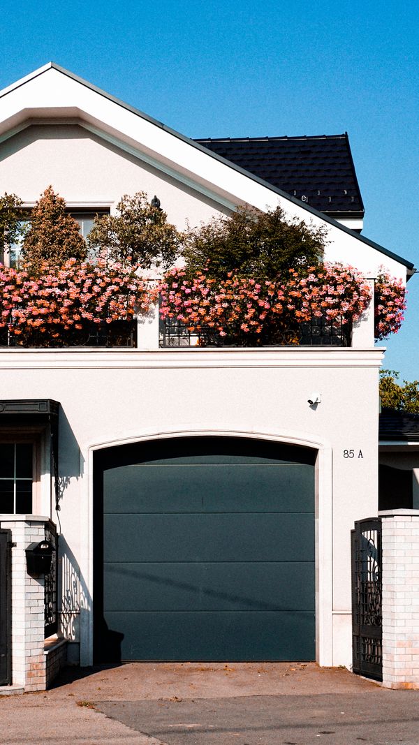Modern residential home with a clean black garage door