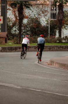 Two cyclists riding on an urban street in Istanbul, Turkey.
