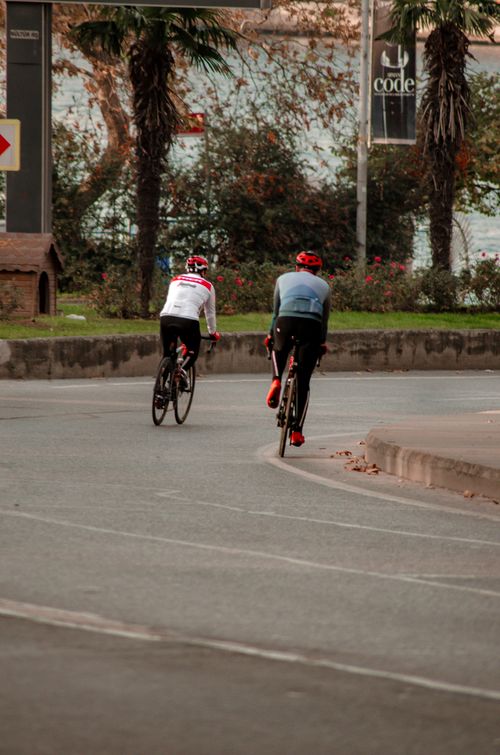 Free Two cyclists riding on an urban street in Istanbul, Turkey. Stock Photo