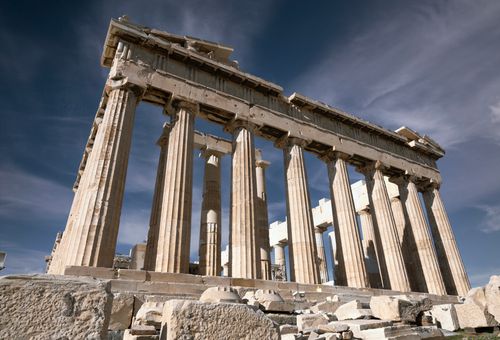 Free Experience the grandeur of ancient Greek architecture at the Parthenon in Athens under a clear blue sky. Stock Photo