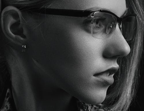 Close-Up Shot of a Woman Wearing Eyeglasses