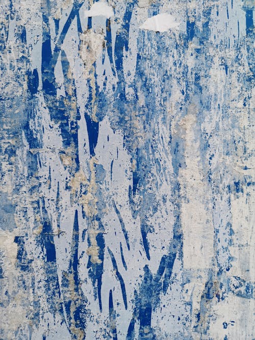 Close-up of a Rough, Worn Surface in Blue and White Colors 