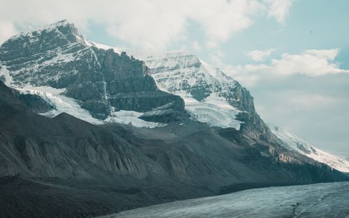 Free Explore the breathtaking winter landscape of Jasper National Park with its snow-capped mountains and icy terrain. Stock Photo