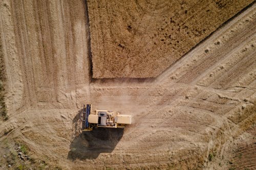 Tractor on Brown Field