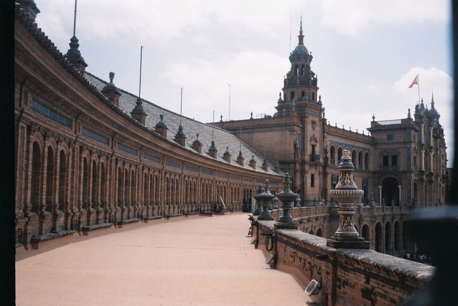 Capture of the stunning architecture at Plaza de España in Seville, Spain, showcasing its historical design.