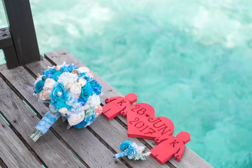 White and Blue Rose Bouquet on Gray Wooden Table